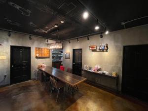 a dining room with a wooden table and chairs at TwoTwo House in Seoul