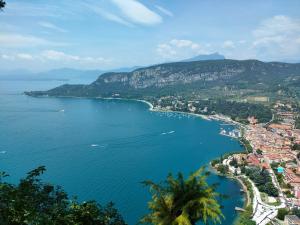 a view of a bay with boats in the water at Hotel Tre Corone in Garda