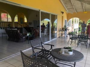 a patio with a table and chairs and a restaurant at Famili Villa in Old Towne