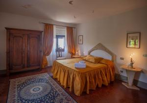 Postel nebo postele na pokoji v ubytování Villa Le Querciolaie