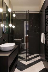 a bathroom with a tub and a sink and a shower at Candy Ballerina No 3 Zagreb Center - top positon Lux in Zagreb