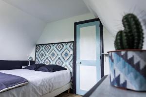 Łóżko lub łóżka w pokoju w obiekcie La Villa de l'Etoile 10 personnes