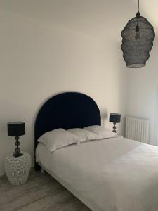 Łóżko lub łóżka w pokoju w obiekcie VILLA LA QUIETUDE