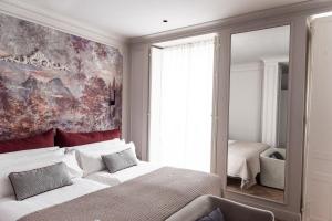 Postel nebo postele na pokoji v ubytování Soho Boutique Palacio de Pombo + 37 fotografií
