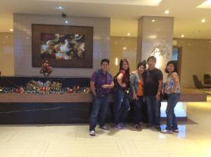 a group of people posing for a picture in a lobby at Elize Wind Residences in Tagaytay