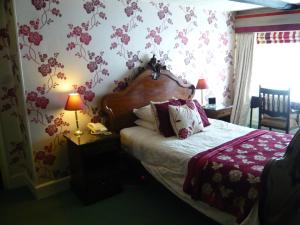 Postel nebo postele na pokoji v ubytování Meryan House Hotel