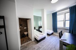 Ένα ή περισσότερα κρεβάτια σε δωμάτιο στο LUXOMES: Aparthotel Nürnberg Zentrum Süd