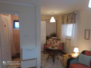 a living room with a couch and a table at KosMaj Dan Belgrade, Sopot in Belgrade