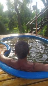 a man is in a pool of water at Krasia May in Tigre