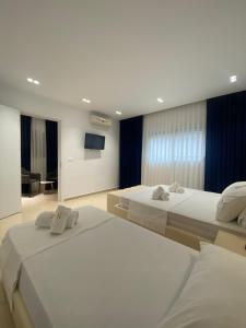 Katil atau katil-katil dalam bilik di Qeparo Napolon Complex