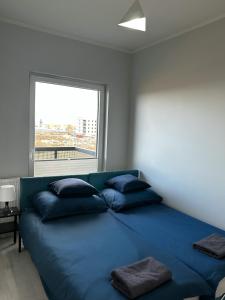 Un pat sau paturi într-o cameră la Apartament na Nowej Cukrowni