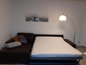 Postelja oz. postelje v sobi nastanitve Erdgeschoss-Appartement mit Seeblick