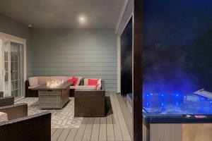 a patio with a table and a fish tank at Mojo's Dojo in McKinleyville