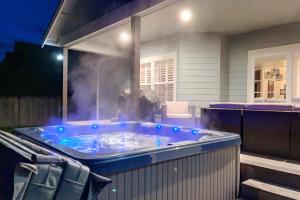 a hot tub on a patio at night at Mojo's Dojo in McKinleyville
