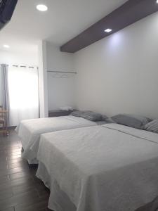 Postel nebo postele na pokoji v ubytování Hotel y Plaza JMI