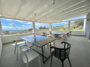 a dining room with a view of the ocean at Villa Mila Kastela in Kastel Novi