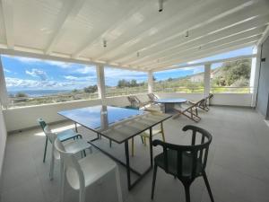 a dining room with a view of the ocean at Villa Mila Kastela in Kastel Novi