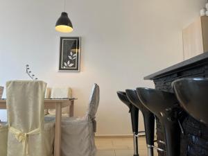 a dining room with a table and some chairs at Apartman Maja in Selce