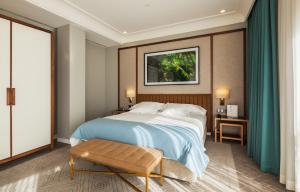 a rendering of a bedroom with a large bed at Vincci Porto in Porto +36 photos