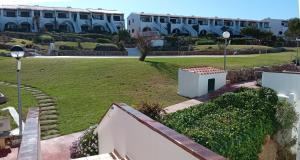 a view of a park in front of a building at Costa Arenal 112 in Arenal d'en Castell