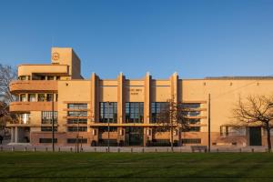a large building with a park in front of it at Vincci Porto in Porto