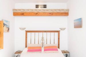 Postel nebo postele na pokoji v ubytování La Azotea-Califa Casas Vejer