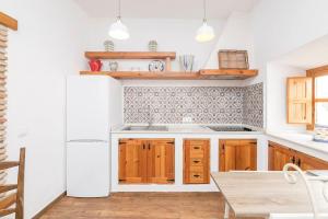Kuchyň nebo kuchyňský kout v ubytování La Azotea-Califa Casas Vejer + 17 fotografií