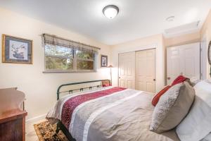 a bedroom with a bed and a window at Tree Top View Cabin in Felton