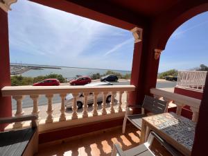 a balcony with a view of the ocean at Estudios Costavigía Mazagón by Ramona in Mazagón