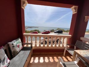a balcony with a view of the ocean at Estudios Costavigía Mazagón by Ramona in Mazagón