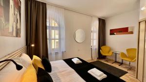 Posteľ alebo postele v izbe v ubytovaní Hotel77