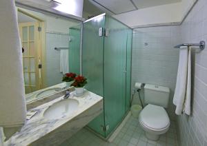 a bathroom with a sink and a toilet and a shower at Ibis Budget Salvador in Salvador