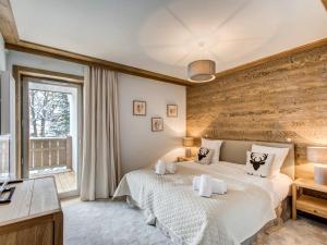 Llit o llits en una habitació de Appartement Courchevel 1550, 4 pièces, 6 personnes - FR-1-562-37