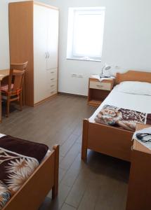 Posteľ alebo postele v izbe v ubytovaní Apartments Igor
