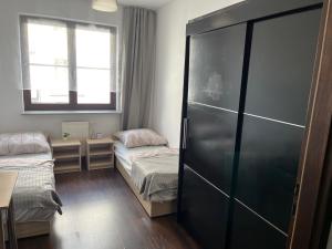Кровать или кровати в номере Tylna 8 Apartments