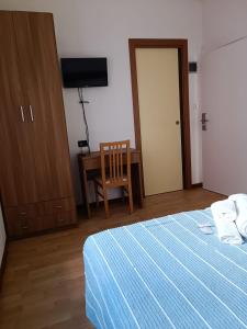 Postel nebo postele na pokoji v ubytování HOTEL VILLA ELISA