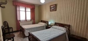 מיטה או מיטות בחדר ב-Casa rural Villa Dulcinea