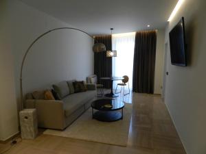 a living room with a couch and a table at HOTEL MANEL in Martorell