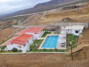 an aerial view of a house with a swimming pool at LA POSADA DE NEIZAN in Bocapán