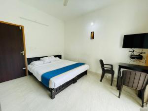 Ένα ή περισσότερα κρεβάτια σε δωμάτιο στο Nandana's Residency Munnar - A 4BHK Homestay for Indian Families +69 φωτογραφίες