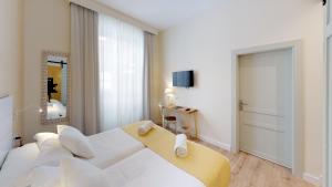 Posteľ alebo postele v izbe v ubytovaní Madeinterranea Suites