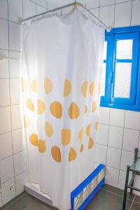 a shower curtain in a bathroom with a window at La Esperanza Beach- Zona Pubs y Restaurantes in Mojácar
