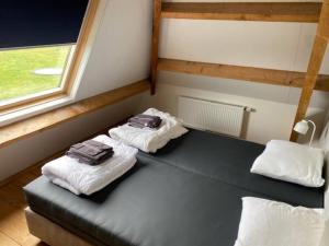 Postel nebo postele na pokoji v ubytování Ballumerhoeve Fleuri lodge