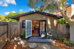 a small house with a gate and a fence at Seashore Studio in San Diego