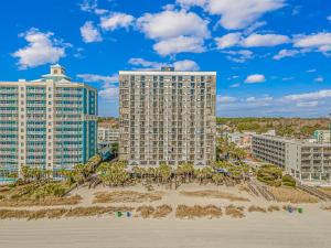 a view of two buildings from the beach at Sun N Sand 607 in Myrtle Beach