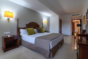 Cama o camas de una habitación en Crisol Jardines de Córdoba