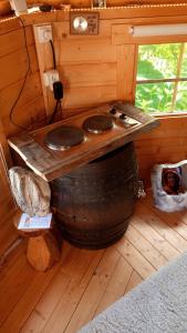 a bathroom with two sinks on top of a barrel at KOTA Finlandais bien être , les gîtes de l'étang in La Chapelle