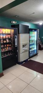 a grocery store with an open refrigerator in a store at Quality Inn in Dry Ridge