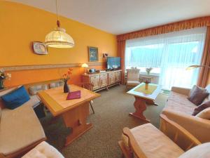 a living room with a couch and a table at Apartments in Bad Mitterndorf - Steiermark 41117 in Bad Mitterndorf