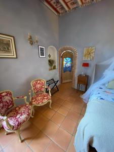 Katil atau katil-katil dalam bilik di Manoir du Bouyssou